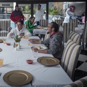 Clients at ARC Addiction Recovery Centre dining together at a large table.