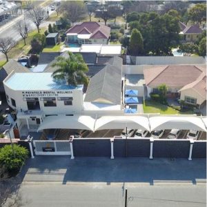 Aerial view of ARC Addiction Recovery Centre showing the main building, surrounding facilities, and parking area.