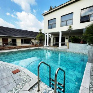 Inviting pool area at a drug and alcohol rehab centre in Johannesburg, featuring modern architecture and a serene environment.